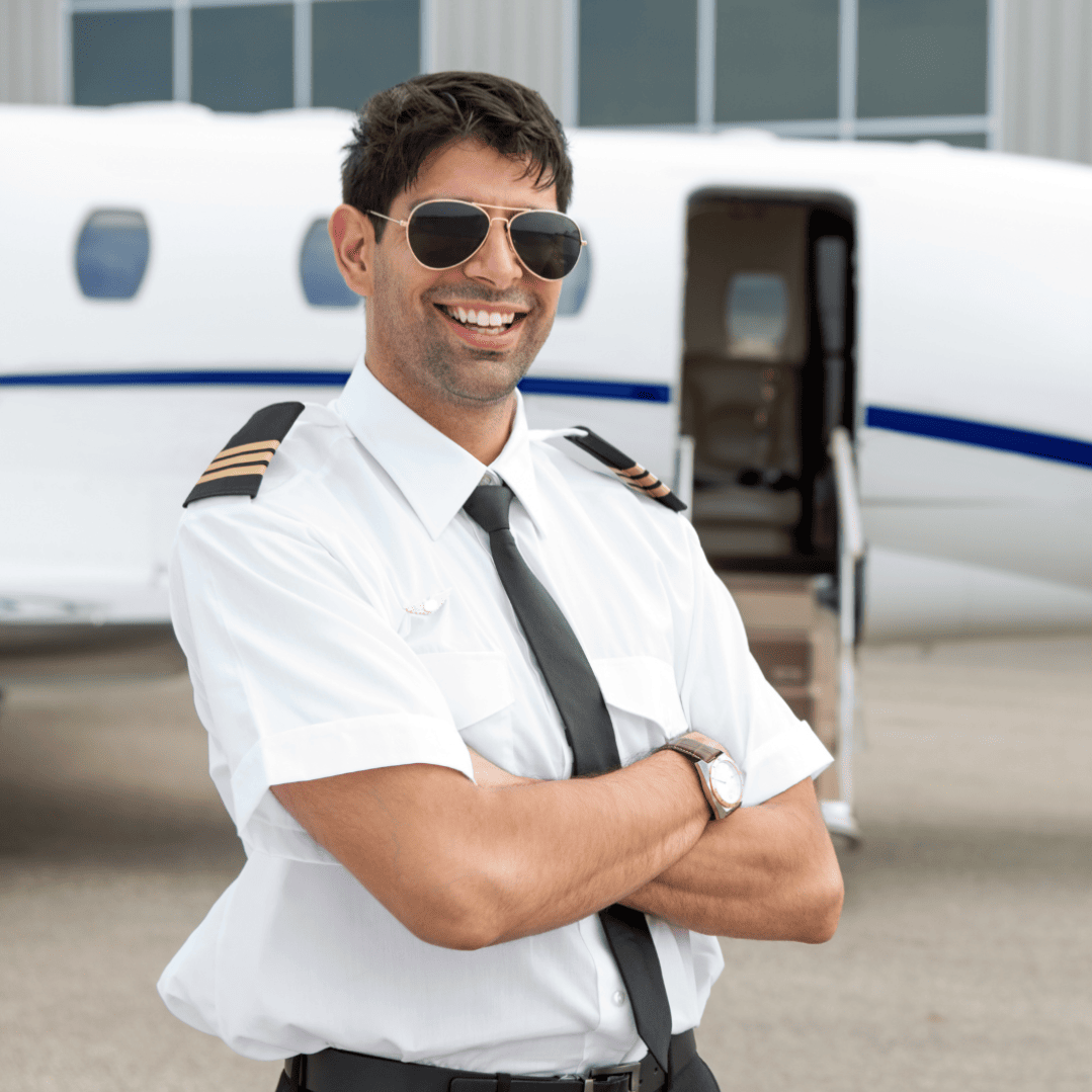 MALE PILOT IN FRONT OF PLANE